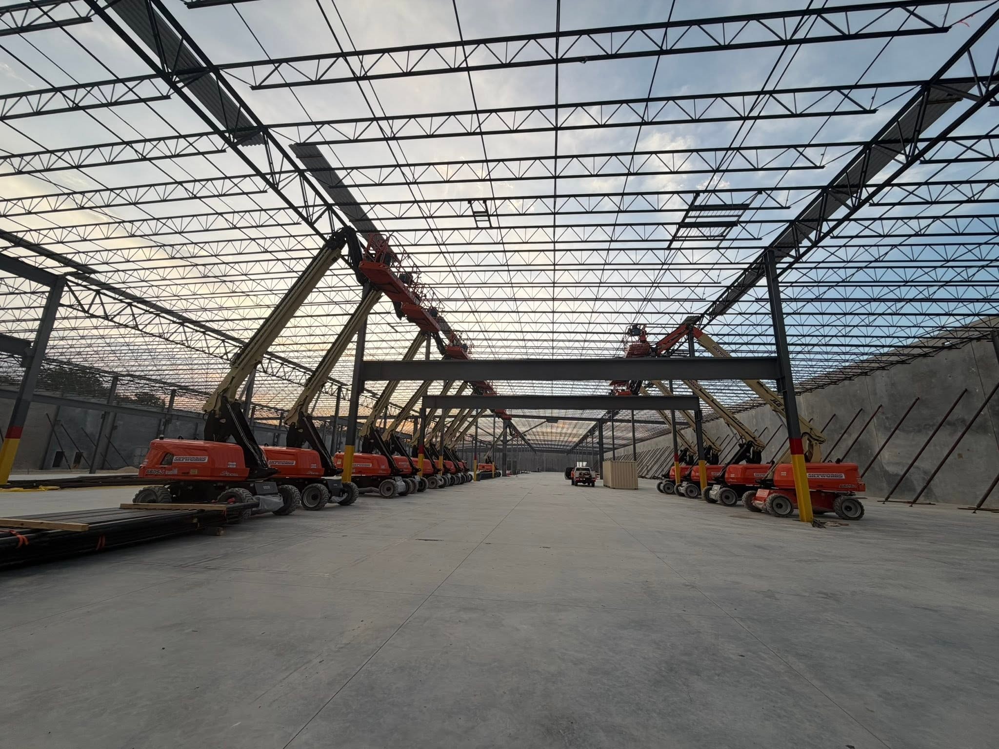 Elite Steel Erectors construction workers on steel framework
